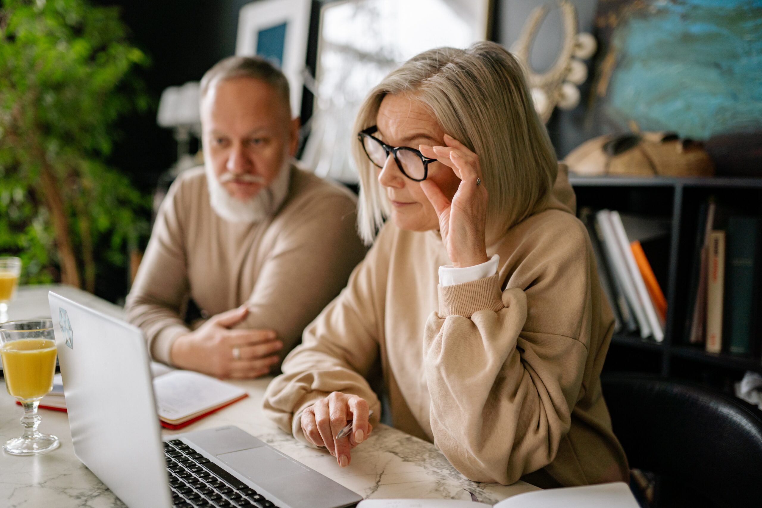retirement age couple looking at pension forms